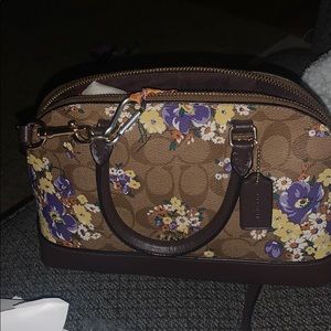 Coach logo with floral purse